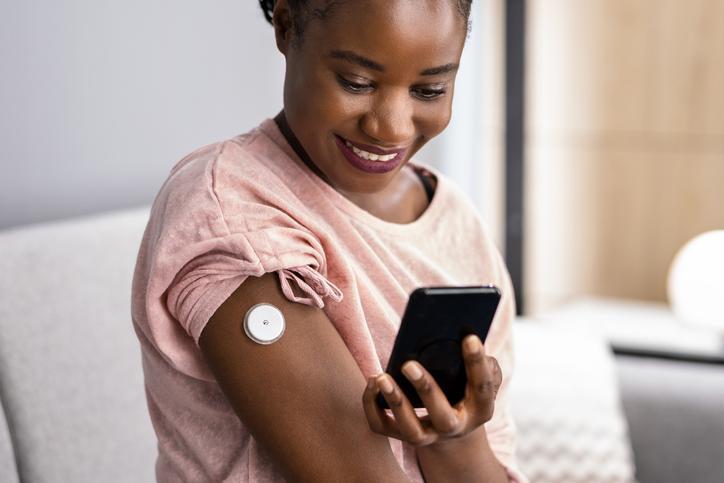 woman checking blood glucose levels