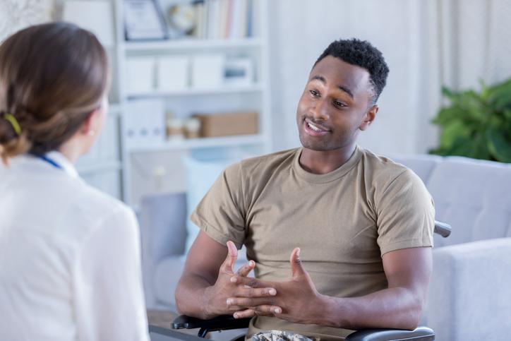 young man talking to doctor