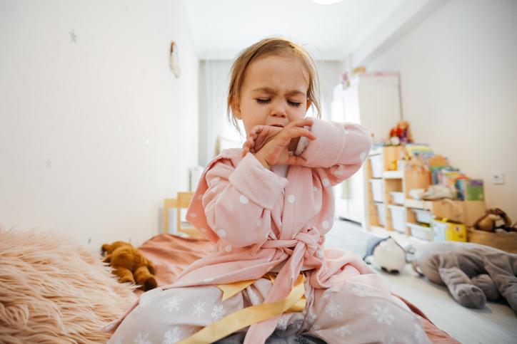 young girl coughing