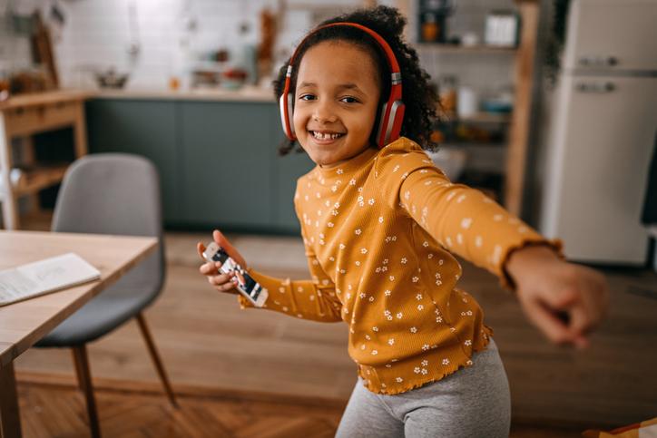 young child dancing to music