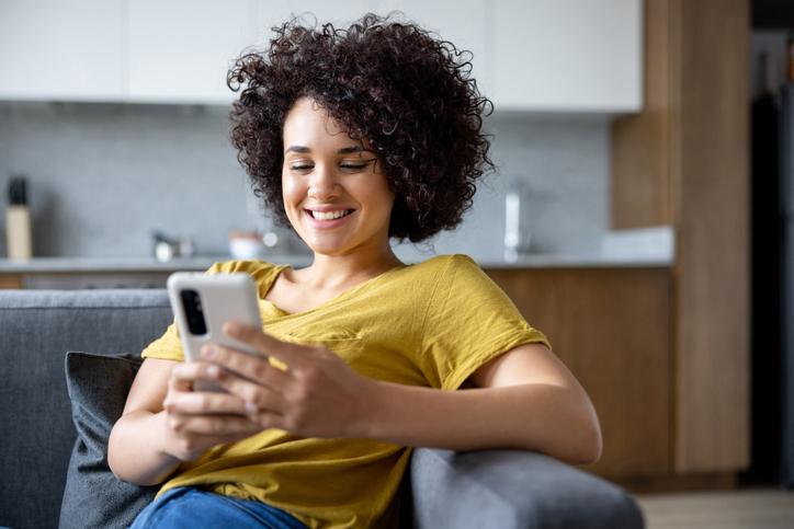 young woman looking at cell phone