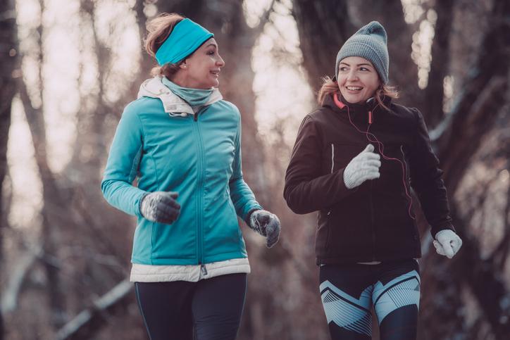 two women exercising outside