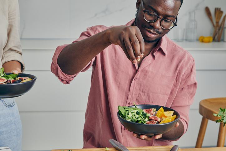 man making a salad