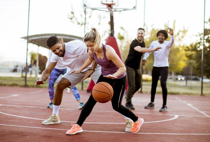 women and men playing basketball