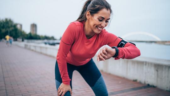 woman looking at watch