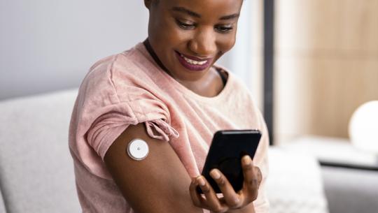 woman checking blood glucose levels