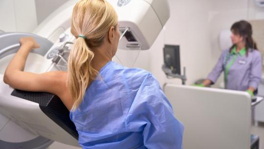 woman getting mammography