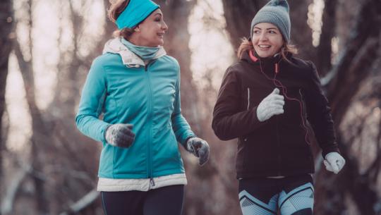 two women exercising outside