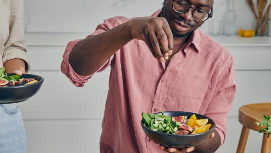 man making a salad