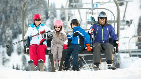 family on ski lift