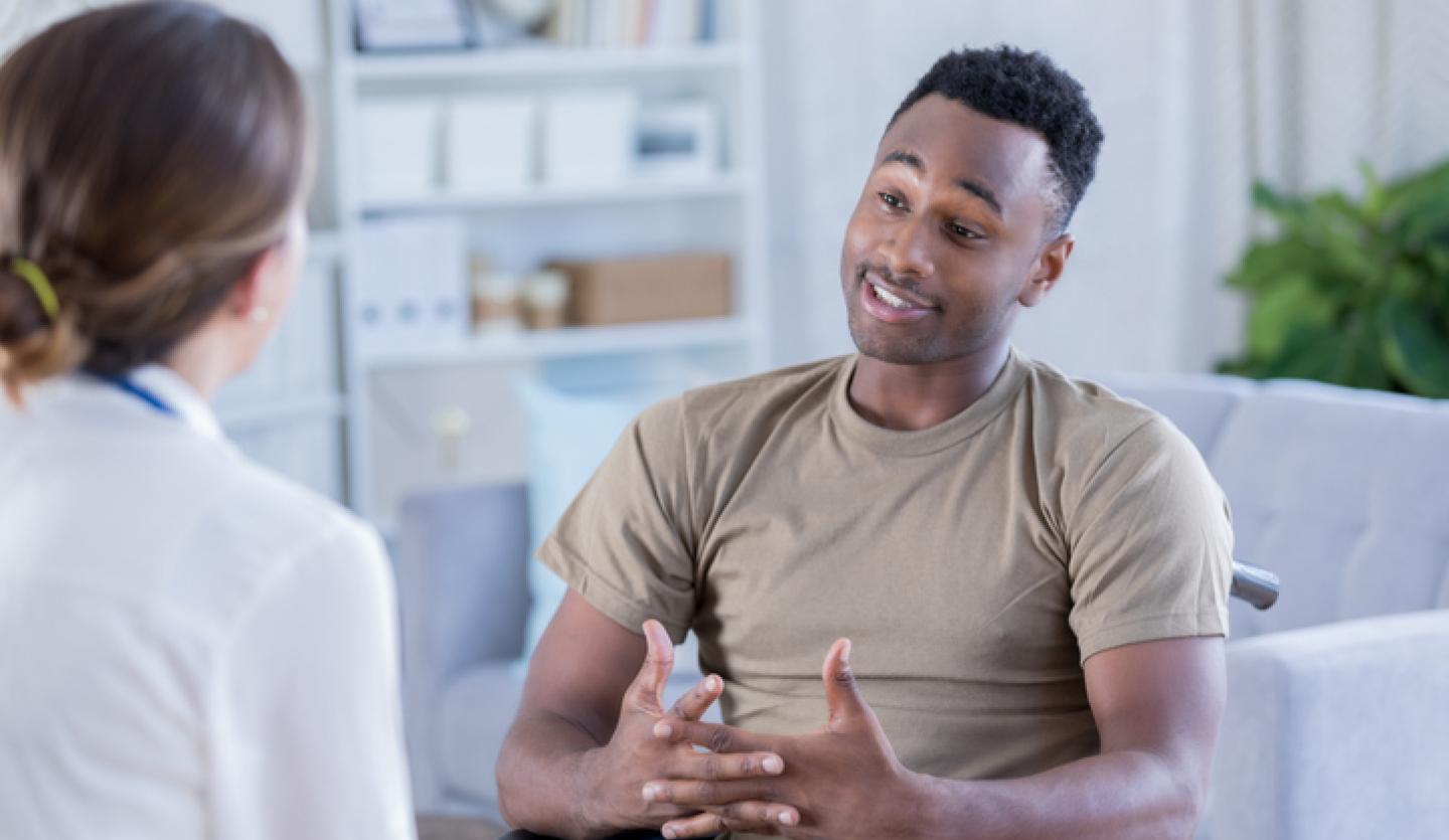 young man talking to doctor