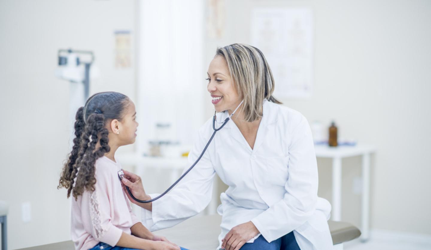 female doctor, young girl patient, doctor's office