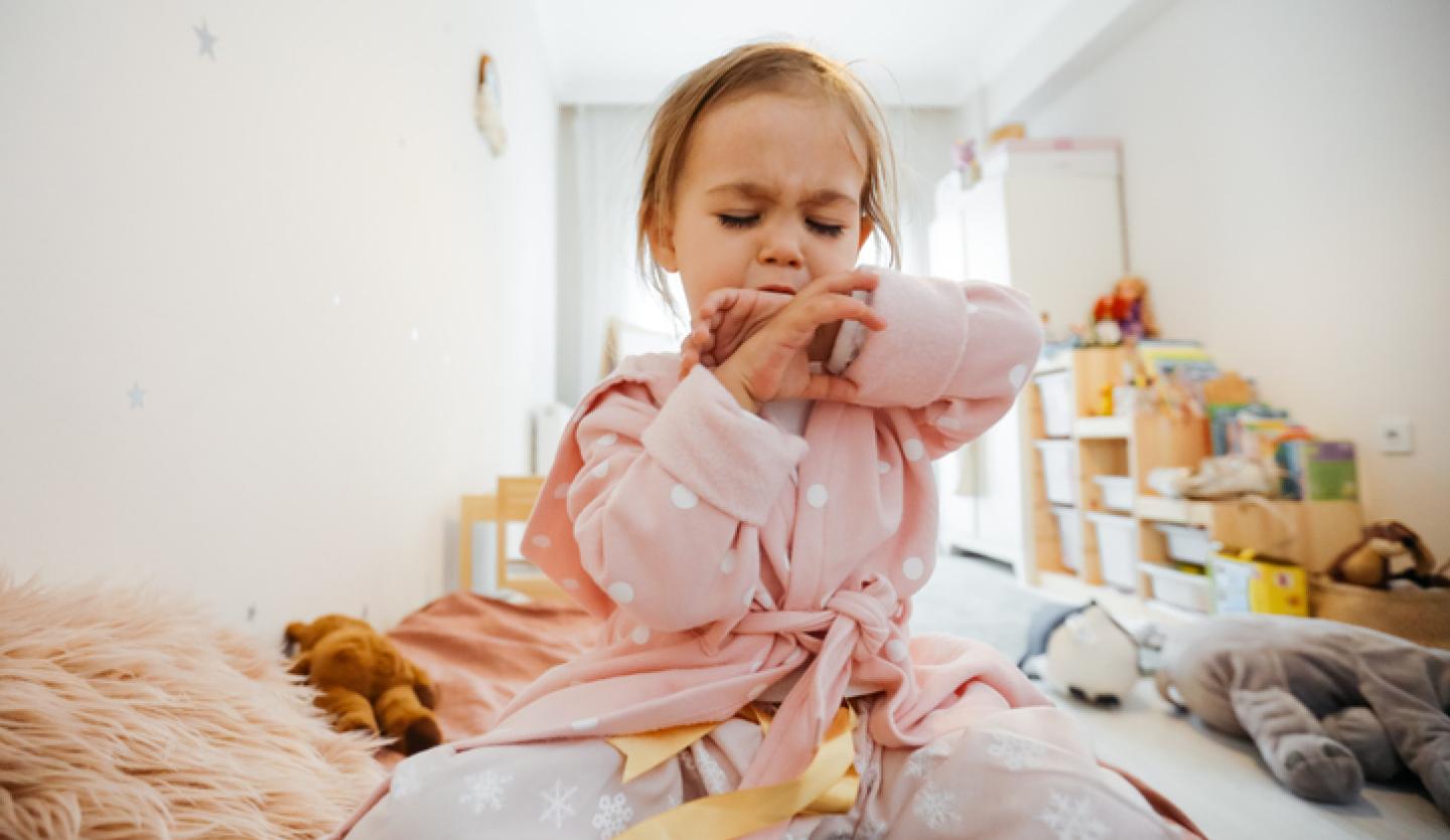 young girl coughing