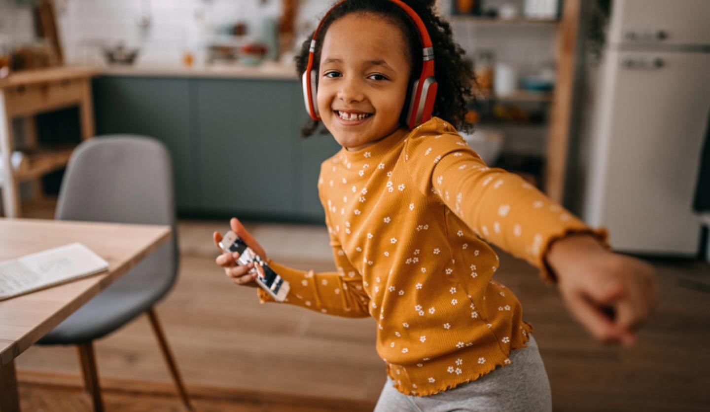 young child dancing to music