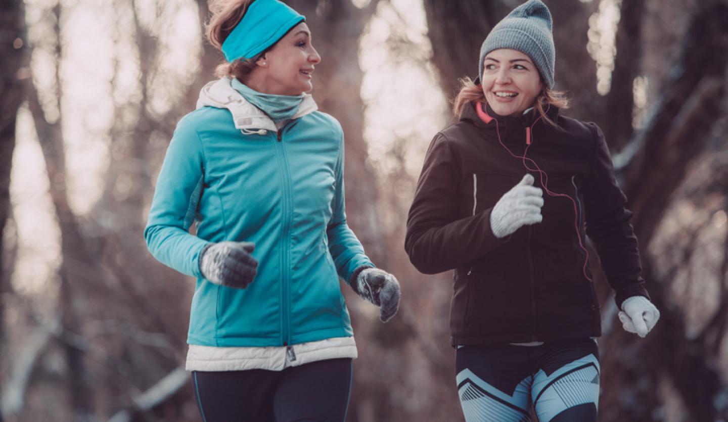 two women exercising outside