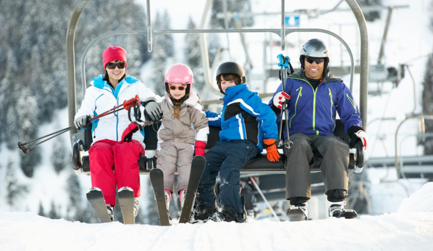 family on ski lift