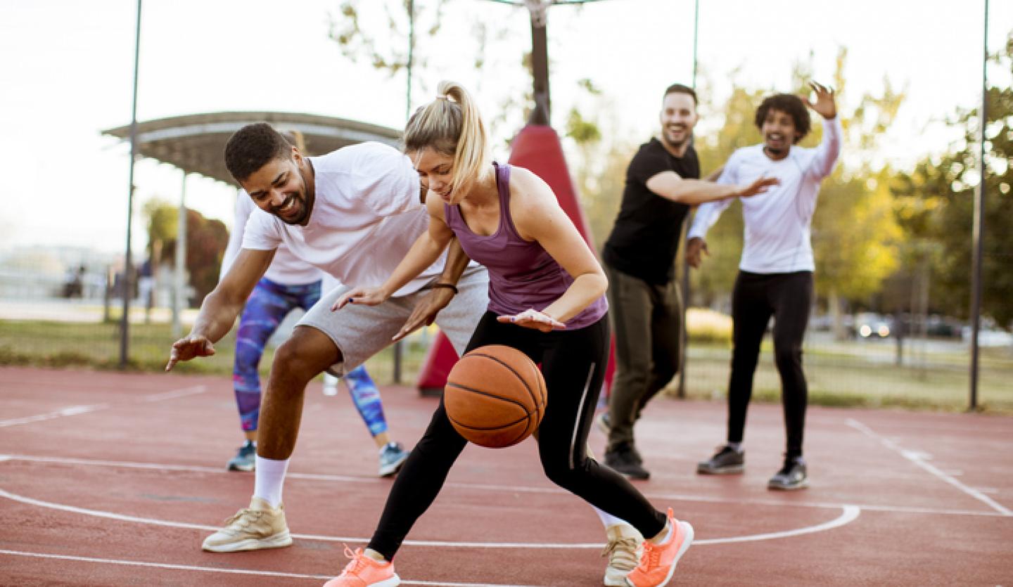 women and men playing basketball