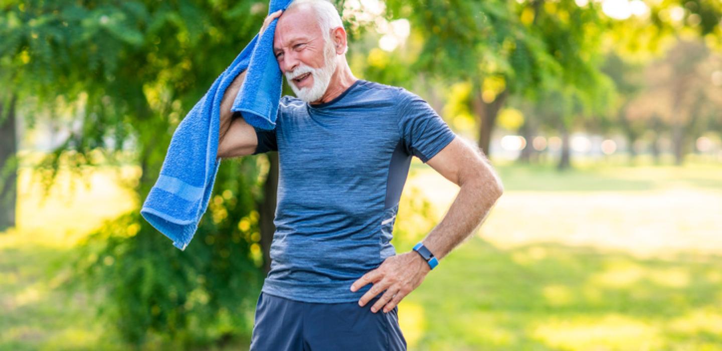 man cooling down with towel