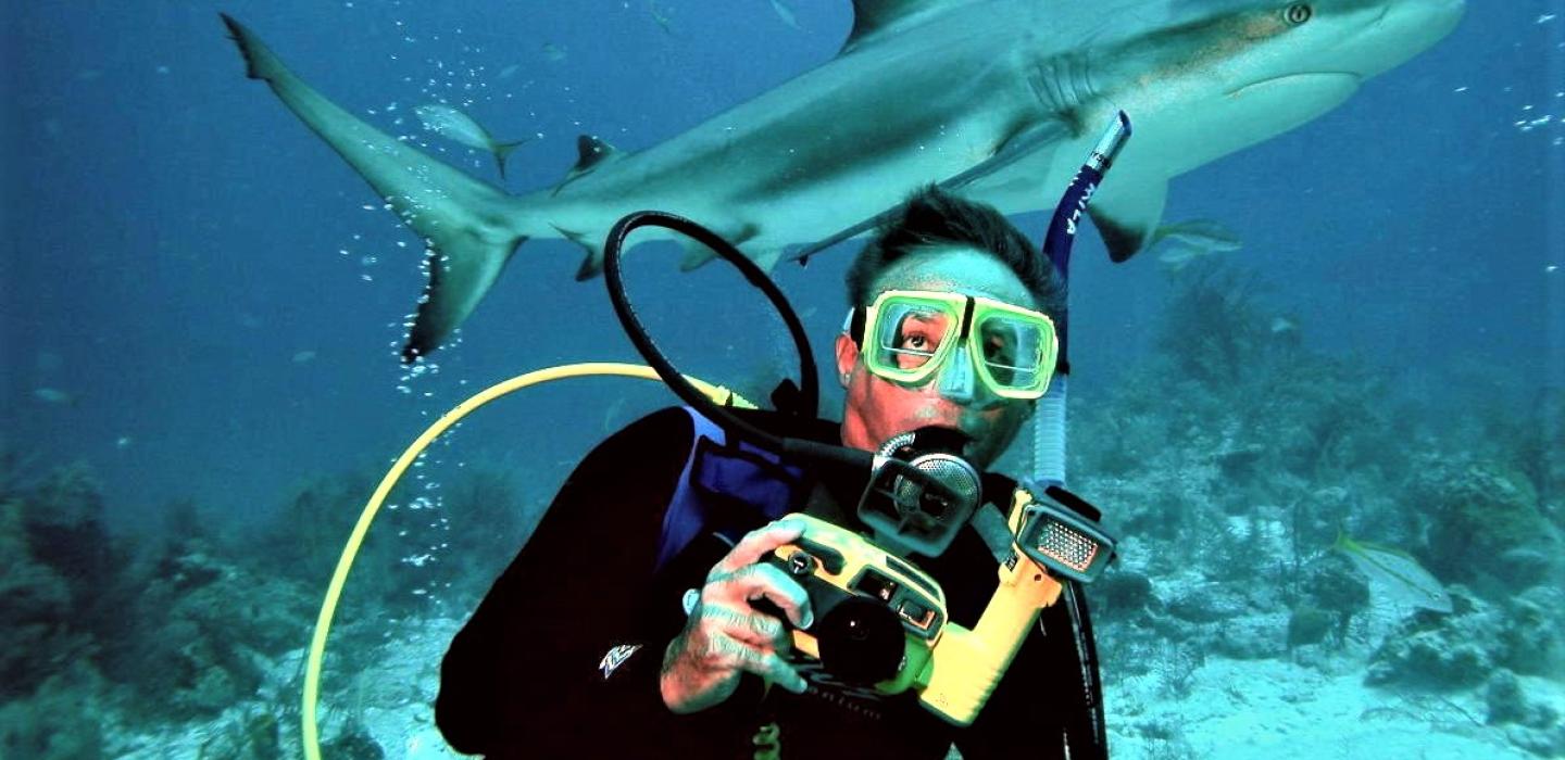 Paul Mila, shark in background