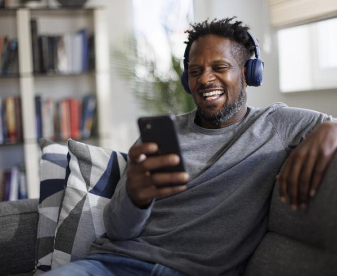 man listening to music with headphones