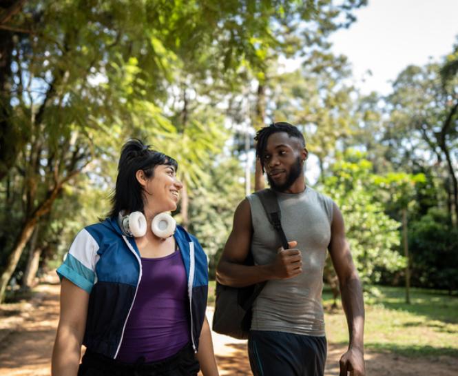 man and woman walking outside