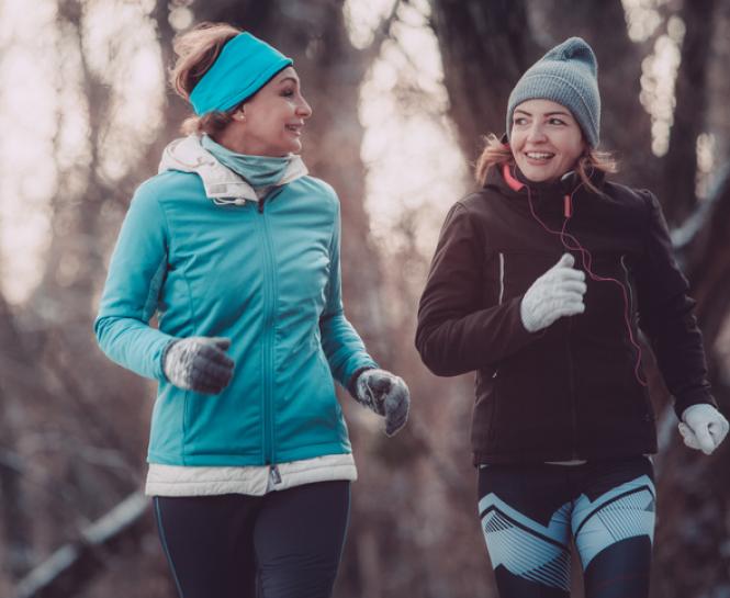 two women exercising outside