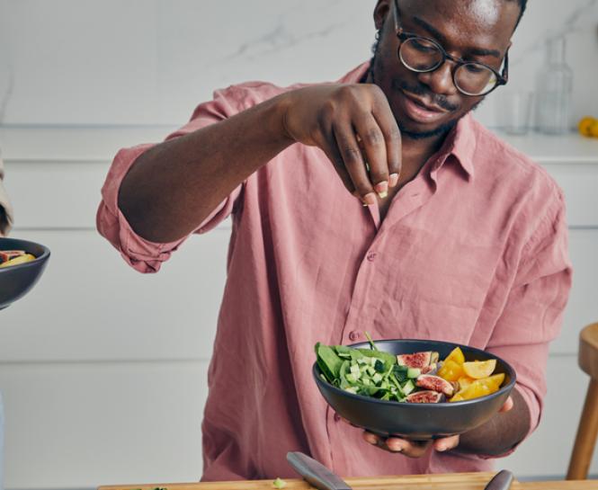 man making a salad