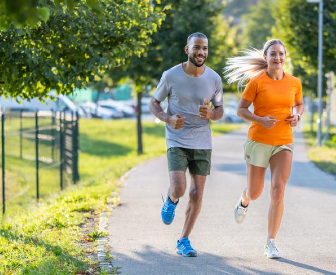 man and woman jogging outside