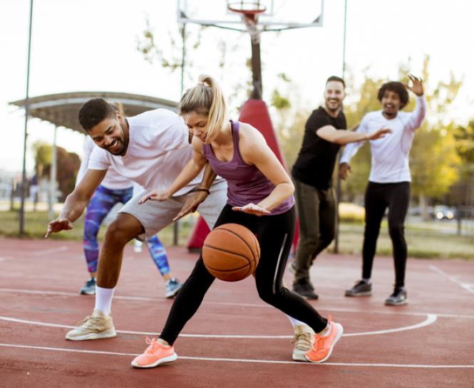 women and men playing basketball