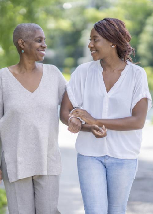 two women walking outside