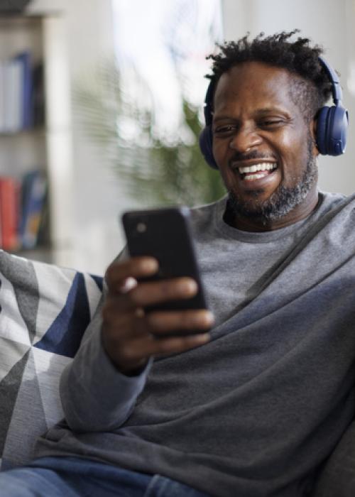 man listening to music with headphones