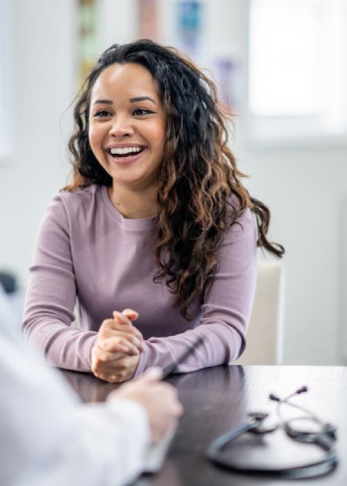 young woman talking to doctor