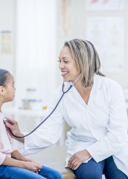 female doctor, young girl patient, doctor's office