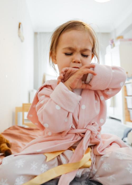 young girl coughing