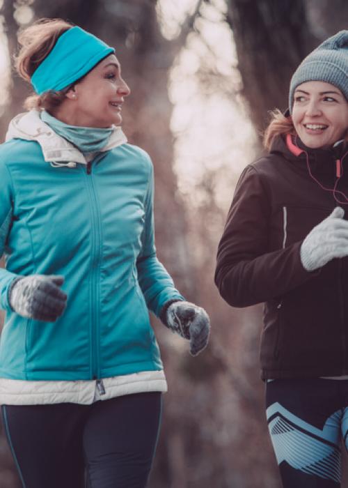 two women exercising outside