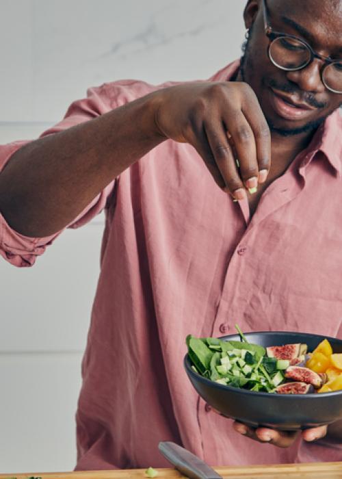 man making a salad