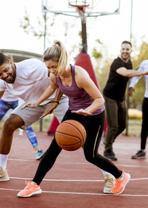 women and men playing basketball